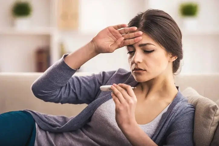 tularemia lady checking body temperature