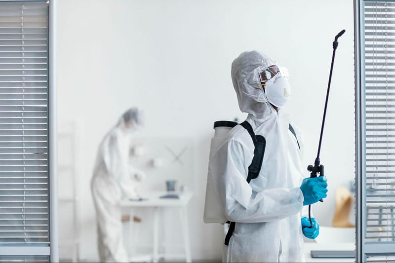 people disinfecting together dangerous area